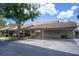 A carport with parking spaces and storage units for a residential townhome complex at 1933 Whitney Way, Clearwater, FL 33760