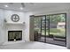 Living room featuring fireplace and screened-in patio with outdoor views at 1933 Whitney Way, Clearwater, FL 33760