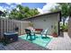 Outdoor patio with furniture, decorative rug, privacy fence, and storage shed, great for relaxing at 1933 Whitney Way, Clearwater, FL 33760