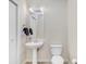 Stylish half bathroom featuring pedestal sink, modern fixtures, and clean design at 2001 E 2Nd Ave # 37, Tampa, FL 33605