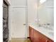 Bathroom featuring double sinks, modern lighting, and laundry area at 2001 E 2Nd Ave # 37, Tampa, FL 33605
