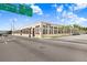 A view of the property exterior and surrounding street including signage and directions to local destinations at 2001 E 2Nd Ave # 37, Tampa, FL 33605