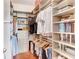 Walk-in closet with custom shelving and hanging storage for organization at 2001 E 2Nd Ave # 37, Tampa, FL 33605