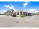 A street view of the property exterior showing ample parking, architectural details, and landscaping at 2001 E 2Nd Ave # 37, Tampa, FL 33605