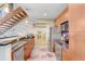 Modern kitchen with stainless appliances and countertops next to wood stairs at 2001 E 2Nd Ave # 37, Tampa, FL 33605
