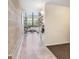 Bright living room with polished floors, exposed brick, modern furniture, and large windows at 2001 E 2Nd Ave # 37, Tampa, FL 33605