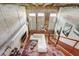 Loft living room with high ceilings, concrete walls, stairs, white sofa, and open design at 2001 E 2Nd Ave # 37, Tampa, FL 33605