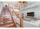 View of loft stairs, living room with concrete walls, and modern decor at 2001 E 2Nd Ave # 37, Tampa, FL 33605