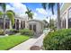 The community pool area includes a utility building as well as surrounding landscaping and lounge furniture at 2001 E 2Nd Ave # 37, Tampa, FL 33605