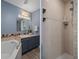 A renovated bathroom featuring an oversized garden tub and walk-in shower with matching sink vanity at 204 Oak Lake Dr, Spring Hill, FL 34608