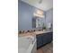A renovated bathroom featuring an oversized garden tub and walk-in shower with updated sink vanity at 204 Oak Lake Dr, Spring Hill, FL 34608