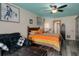 Stylish bedroom with a black platform bed, modern furniture, and calming wall decor at 204 Oak Lake Dr, Spring Hill, FL 34608