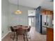 Bright dining area with seating for four, adjacent to kitchen and doorway view at 204 Oak Lake Dr, Spring Hill, FL 34608