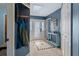 Bright hallway with tile flooring, blue accent walls and a decorative glass front door at 204 Oak Lake Dr, Spring Hill, FL 34608