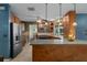 Open kitchen with generous counter space, wood cabinets, and modern appliances at 204 Oak Lake Dr, Spring Hill, FL 34608