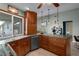 Inviting kitchen featuring wooden cabinetry, modern appliances, and natural light at 204 Oak Lake Dr, Spring Hill, FL 34608