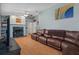 Relaxing living room with a fireplace and comfortable leather seating arrangement at 204 Oak Lake Dr, Spring Hill, FL 34608