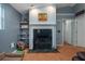 Inviting living room showcasing a fireplace with a marble surround and built-in shelving at 204 Oak Lake Dr, Spring Hill, FL 34608