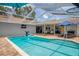 A beautiful screened-in pool area perfect for outdoor entertaining and relaxation at 204 Oak Lake Dr, Spring Hill, FL 34608