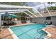Enjoy the refreshing pool inside this screened enclosure for year-round outdoor enjoyment at 204 Oak Lake Dr, Spring Hill, FL 34608