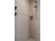 A spacious walk-in shower featuring matching tile work and updated shower head and fixture at 204 Oak Lake Dr, Spring Hill, FL 34608