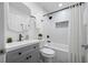 Bathroom with updated vanity, shower-tub combination, and stylish fixtures at 2326 Auburn S St, St Petersburg, FL 33712