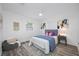 Cozy bedroom featuring a comfortable bed, stylish decor, and plenty of natural light from the windows at 2326 Auburn S St, St Petersburg, FL 33712