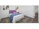 Nicely decorated bedroom with hardwood floors, plush bedding, and ample closet space at 2326 Auburn S St, St Petersburg, FL 33712