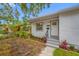 This charming home features a stucco exterior, manicured landscaping, and a welcoming entryway, perfect for curb appeal at 2326 Auburn S St, St Petersburg, FL 33712