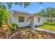 Charming single-story home with a well-maintained stucco exterior, landscaped front yard, and welcoming entrance at 2326 Auburn S St, St Petersburg, FL 33712