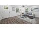 Cozy living room with wood-look floors, abundant natural light, and comfortable seating arrangement; an inviting living space at 2326 Auburn S St, St Petersburg, FL 33712