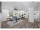 Bright and airy living room features modern decor, sleek flooring, and ample space for entertaining and relaxation at 2326 Auburn S St, St Petersburg, FL 33712