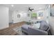 Stylishly decorated living area with new flooring, neutral tones, and comfortable seating; an inviting space to relax at 2326 Auburn S St, St Petersburg, FL 33712