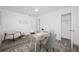 Bright office with hardwood floors, clean desk, open closet and modern décor at 2326 Auburn S St, St Petersburg, FL 33712