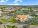 Aerial view of community amenities, including pool, tennis courts, and clubhouse at 2330 Ecuadorian Way # 30, Clearwater, FL 33763