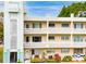 Charming multi-story condo building featuring a unique facade and a welcoming coastal design with a bright, airy feel at 2330 Ecuadorian Way # 30, Clearwater, FL 33763
