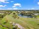 Picturesque golf course view with a tranquil pond and manicured greens at 2330 Ecuadorian Way # 30, Clearwater, FL 33763