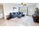 Sunlit living room with a comfortable blue sofa, a stylish coffee table, and a view of the outdoor scenery at 2330 Ecuadorian Way # 30, Clearwater, FL 33763