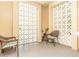 Cozy patio featuring decorative breeze blocks and wicker chairs with comfortable cushions at 2330 Ecuadorian Way # 30, Clearwater, FL 33763