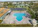 Aerial view of a community pool and parking, offering residents a relaxing recreational amenity at 2330 Ecuadorian Way # 30, Clearwater, FL 33763
