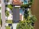 Stunning aerial view of home with a pool, patio, and a boat dock on a waterfront property at 243 45Th Ne Ave, St Petersburg, FL 33703