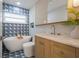 Stylish bathroom with freestanding tub, modern vanity, and eye-catching blue-patterned tile at 243 45Th Ne Ave, St Petersburg, FL 33703