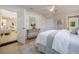 Cozy bedroom features a serene color scheme, elegant decor, and an adjacent living area at 243 45Th Ne Ave, St Petersburg, FL 33703