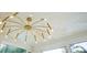 Unique, stylish chandelier with a ceiling accent and natural light at 243 45Th Ne Ave, St Petersburg, FL 33703