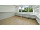Well-lit walk-in closet featuring custom shelving and ample storage, bathed in natural light at 243 45Th Ne Ave, St Petersburg, FL 33703