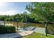 Scenic waterfront view of a private dock, surrounded by lush greenery and a serene waterway at 243 45Th Ne Ave, St Petersburg, FL 33703