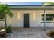 Modern front door with decorative lights and a welcoming entrance to the residence at 243 45Th Ne Ave, St Petersburg, FL 33703