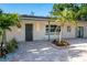Stylish home exterior displaying modern lighting, fresh landscaping, and a gray front door at 243 45Th Ne Ave, St Petersburg, FL 33703
