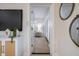 Bright hallway featuring modern decor and light hardwood floors, seamlessly connects living spaces at 243 45Th Ne Ave, St Petersburg, FL 33703