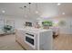 Open concept kitchen island with quartz countertop and stylish pendant lighting at 243 45Th Ne Ave, St Petersburg, FL 33703